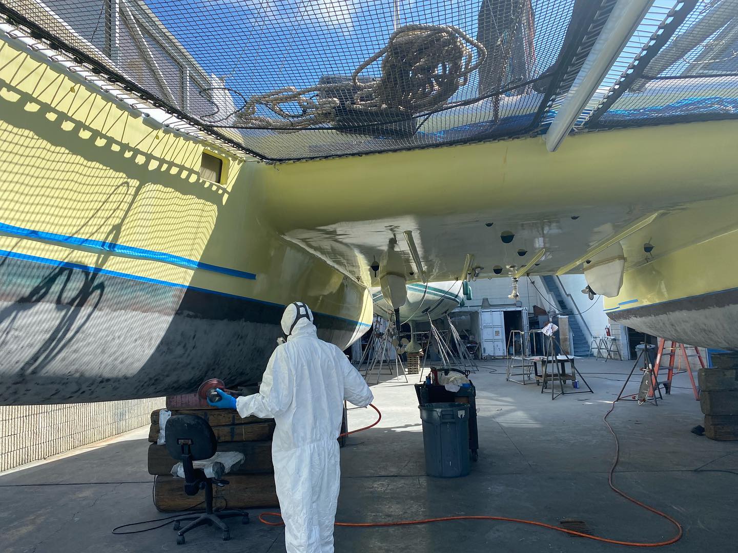 Person doing maintenance on boat